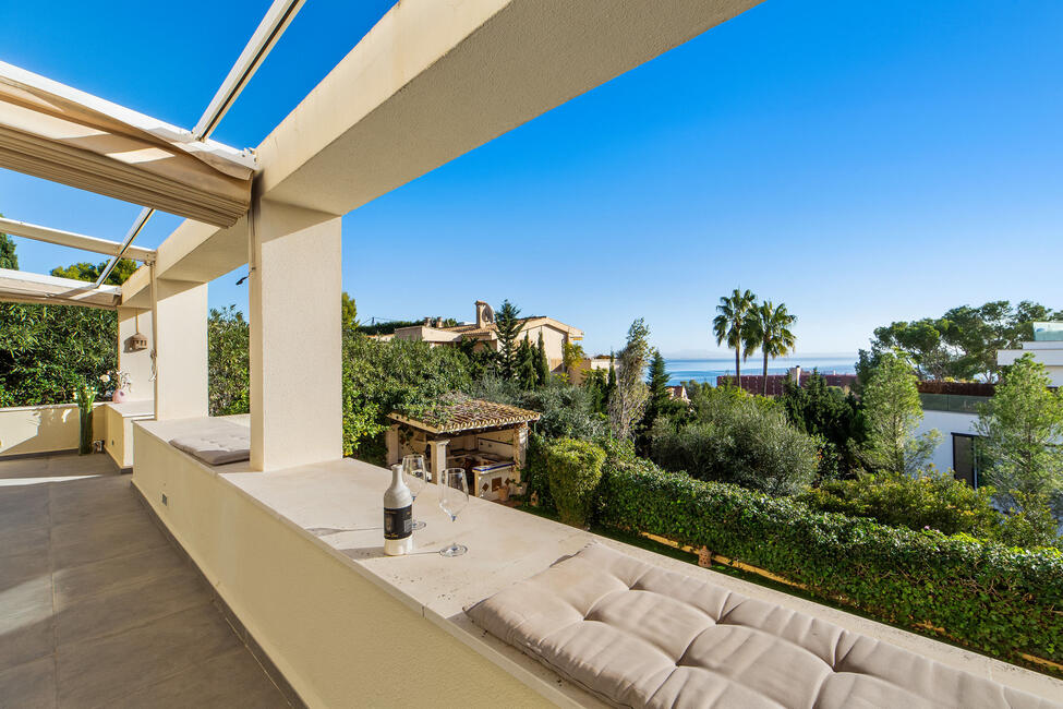 Sonnige Gartenwohnung mit Meerblick und Gemeinschaftspool in Cas Català